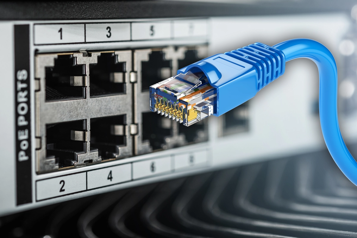 Structured cabling and network switch environment supporting Power over Ethernet cameras, phones, access points, and connected devices.