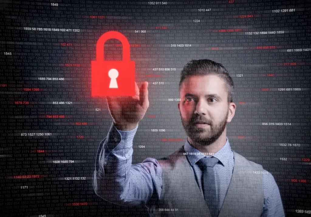 Man touching a padlock which is a security key